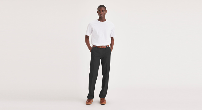 Front view of model wearing Black Workday Khakis, Straight Fit.