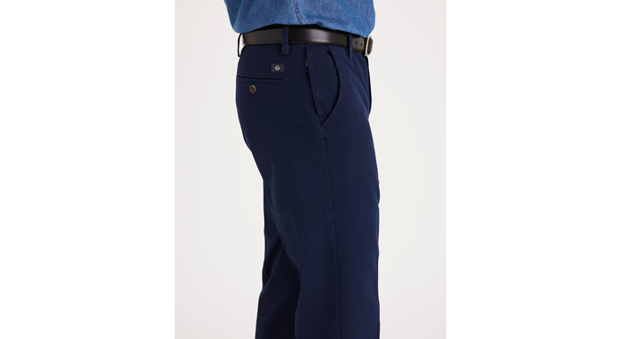 Side view of model wearing Pembroke Workday Khakis, Straight Fit.