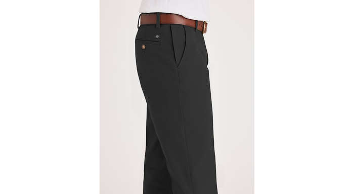 Side view of model wearing Black Workday Khakis, Straight Fit.